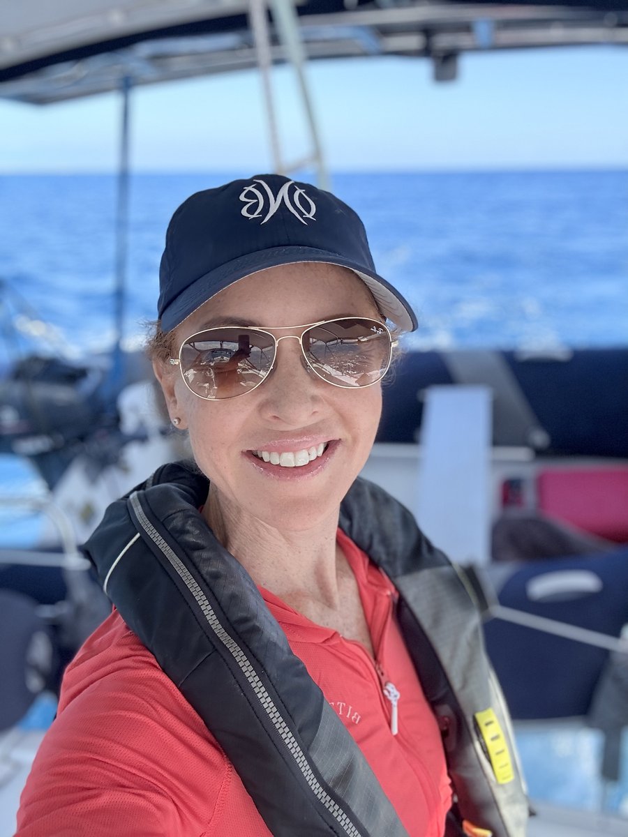 Kylie Schischka on a sailboat in open water